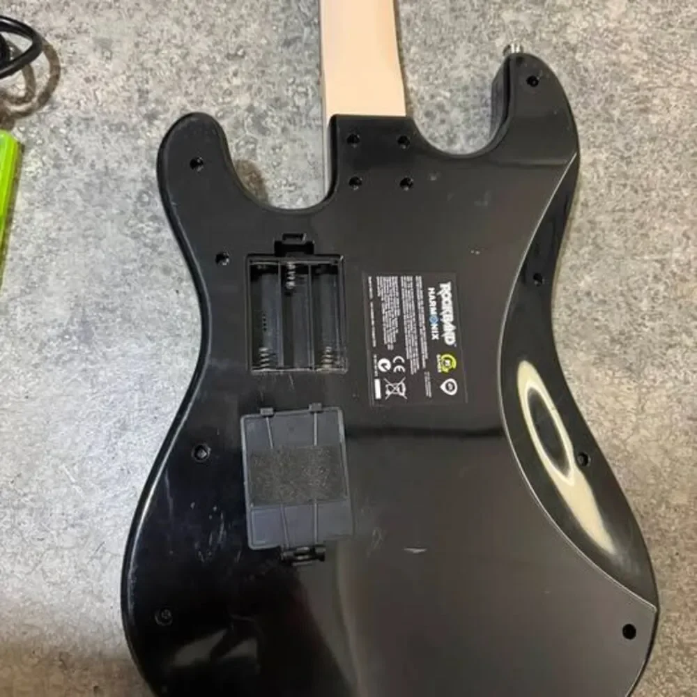 Microsoft Xbox 360 S 250 gb Console with Rock Band Guitar and Game